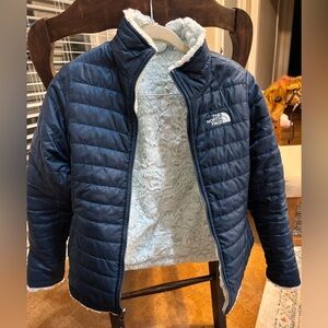 The North Face Navy Puffer Jacket with Light Green Sherpa Lining.  Reversible.